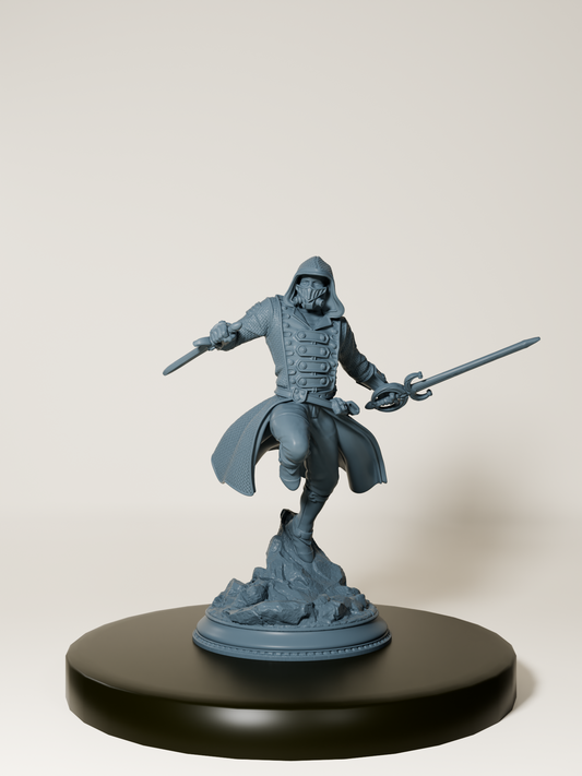 Figurine d’un assassin humain en pleine action, équipé d’un manteau à capuche et de deux lames, dans une posture de combat dynamique sur un socle détaillé.