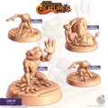 Deux figurines de grenouilles humanoïdes Grung à peindre : l’une nue en posture neutre, l’autre en moine suspendu à un rocher ou accroupi, parfaites pour jeux de rôle fantasy.